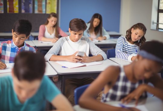 Students sitting at desks in classroom