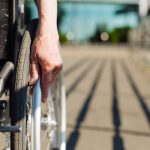 Closeup of person using wheelchair