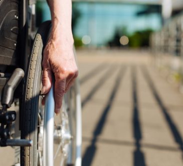 Closeup of person using wheelchair