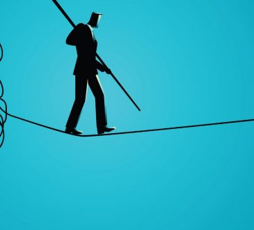 man walking on tightrope