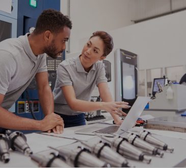 male and female engineers using computer