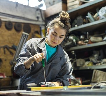 young woman working in a workshop
