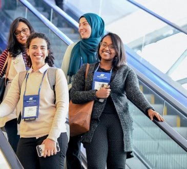 people going down escalator at cannexus conference