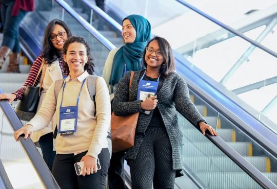 people going down escalator at cannexus conference