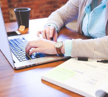 person typing on computer