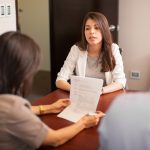 woman looking stressed during job interview