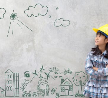 Little girl wearing construction hat