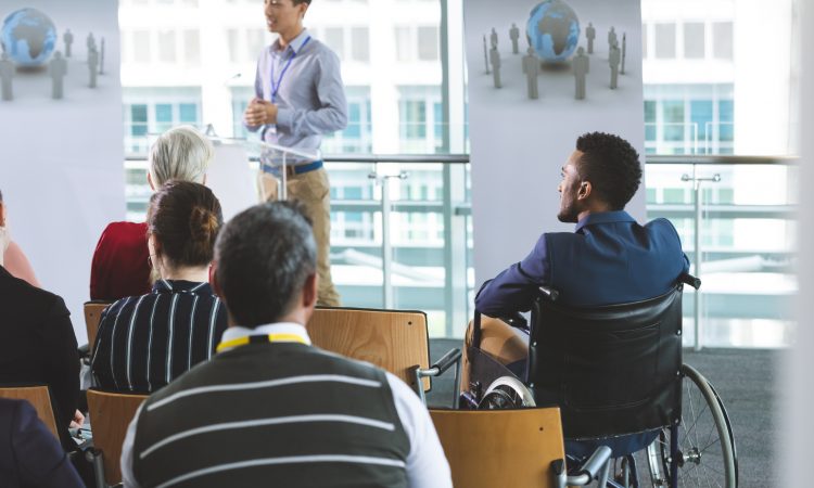 people attending seminar in office
