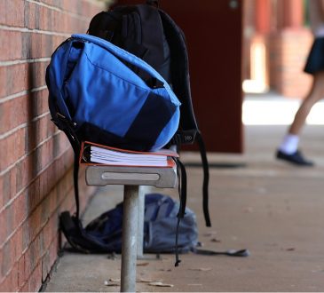 backpack on bench at high school