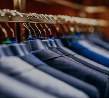 suit jackets hanging on rack