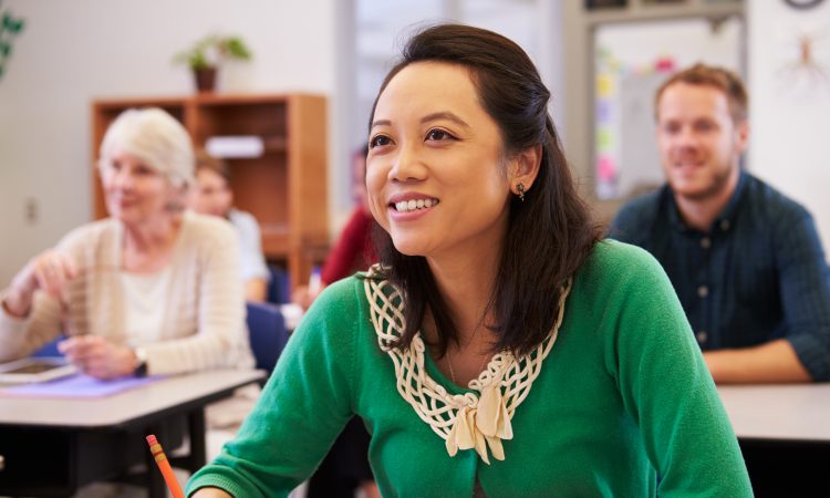 woman looking at the board in an adult education class
