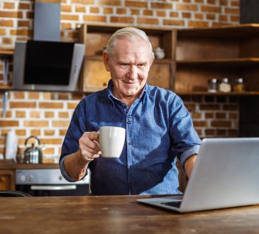 older man using laptop