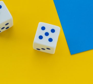 dice on bright yellow background