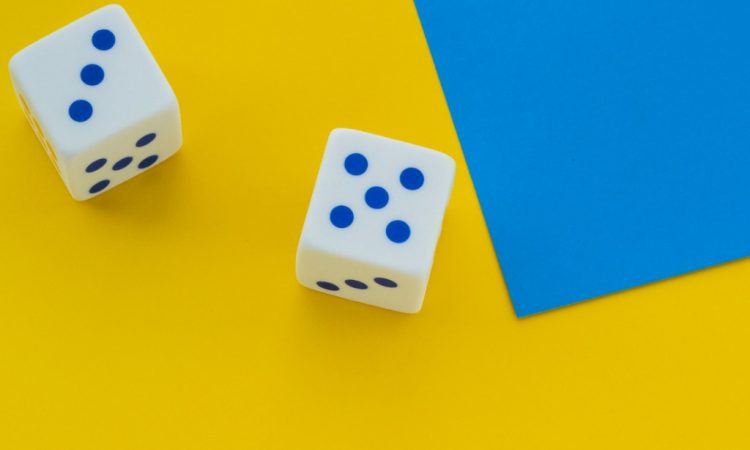 dice on bright yellow background