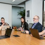 People sitting in board room in office