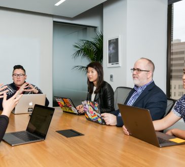 People sitting in board room in office