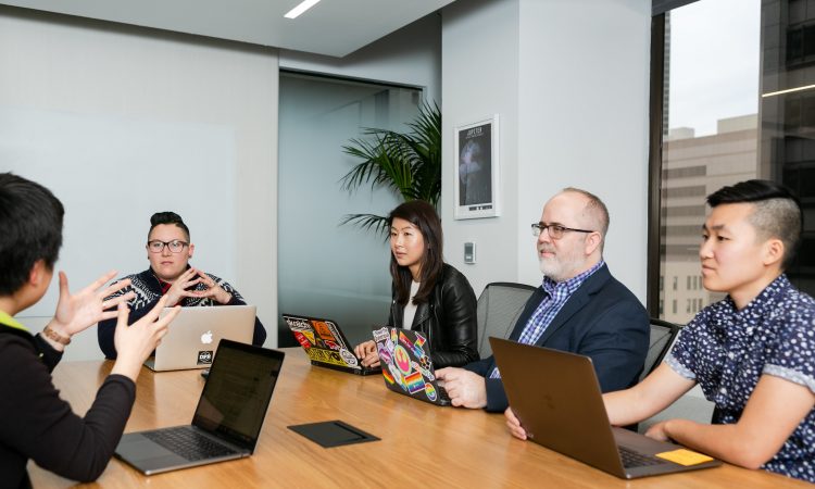 People sitting in board room in office