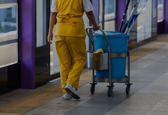 female janitor at transit station