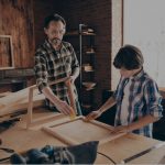 dad and son doing woodworking
