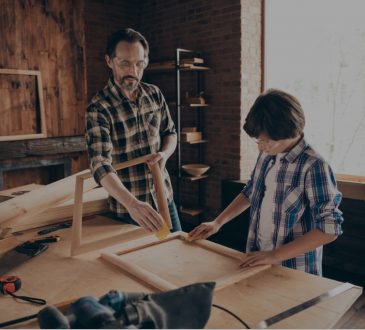 dad and son doing woodworking