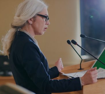woman speaking at podium