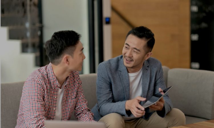two men talking at work