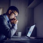 worried man at computer