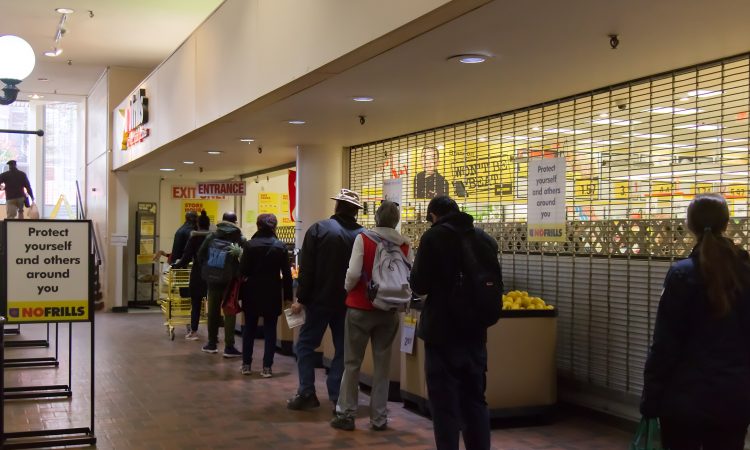 People line up outside grocery store