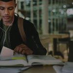 student looking at book