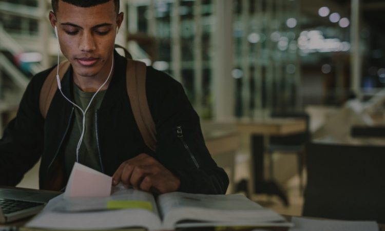 student looking at book