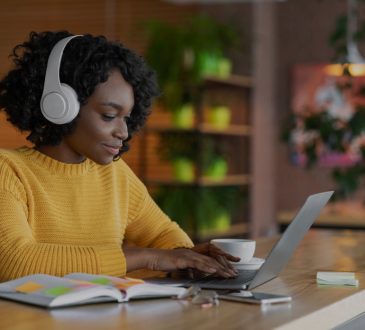 woman watching webinar on laptop
