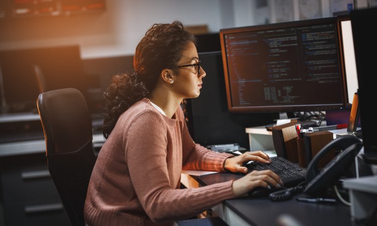 Female programmer working on new project.