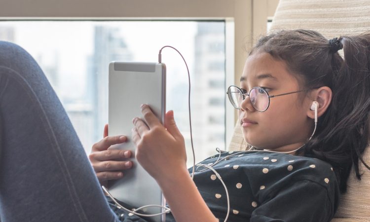Girl using tablet computer