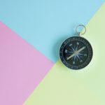 compass on multi-coloured background