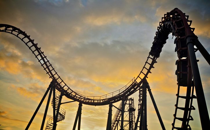 Roller coaster on sunset sky.