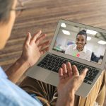 two men having video call