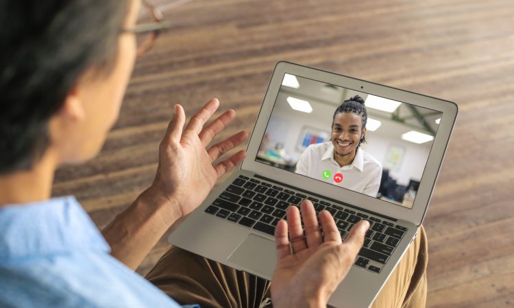 two men having video call