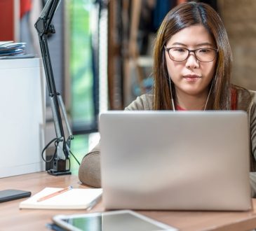 woman watching webinar on laptop