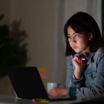 young woman working late at desk