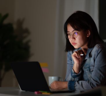 young woman working late at desk