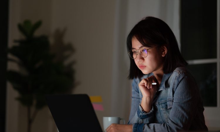 young woman working late at desk