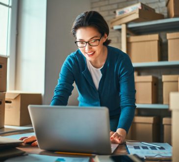 Woman is working at warehouse for online seller.