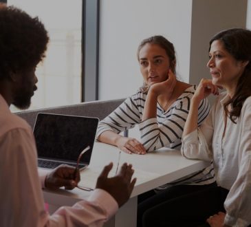 mother and daughter in meeting with teacher