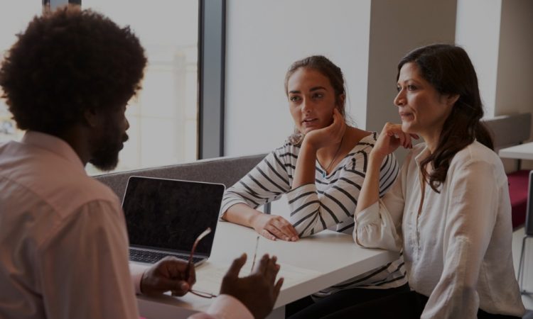 mother and daughter in meeting with teacher