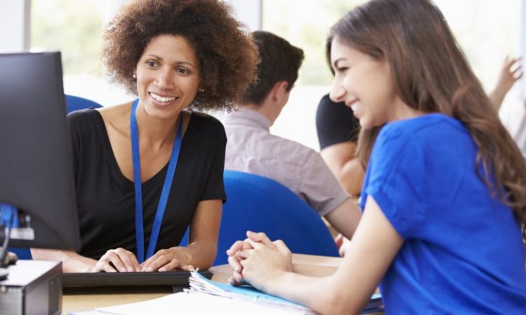 woman working with student in career services