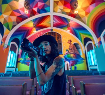 photographer inside colourful building