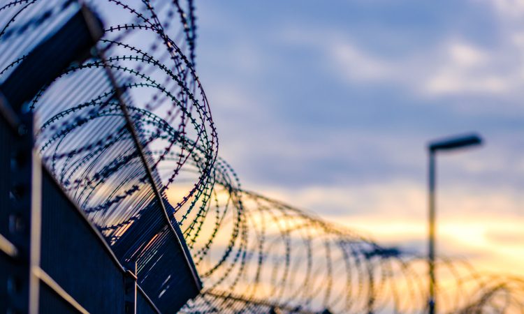barbed wire on prison fence