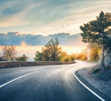 Highway in mountains beside lake