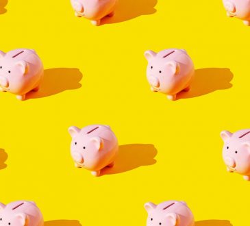 piggy banks on yellow background