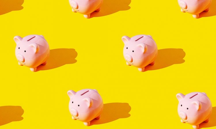 piggy banks on yellow background